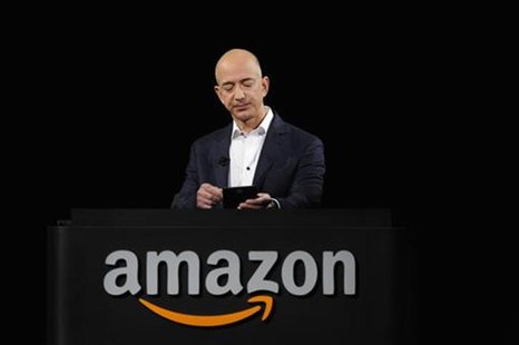 Amazon CEO Jeff Bezos demonstrates the Kindle Paperwhite during Amazon's Kindle Fire event in Santa Monica, California September 6, 2012. RE Amazon CEO Jeff Bezos demonstrates the Kindle Paperwhite during Amazon's Kindle Fire event in Santa Monica, California September 6, 2012. RE