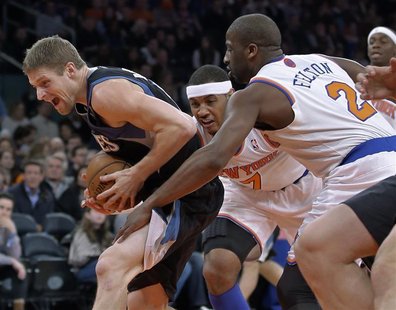 Minnesota Timberwolves forward Andrei Kirilenko reacts as he tries to get past New York Knicks forward Carmelo Anthony (7) and guard Raymond Minnesota Timberwolves forward Andrei Kirilenko reacts as he tries to get past New York Knicks forward Carmelo Anthony (7) and guard Raymond