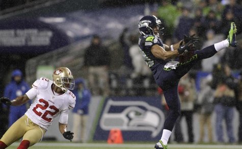 Seattle Seahawks wide receiver Doug Baldwin (R) pulls in a 43-yard pass catch from quarterback Russell Wilson during the first quarter of th Seattle Seahawks wide receiver Doug Baldwin (R) pulls in a 43-yard pass catch from quarterback Russell Wilson during the first quarter of th