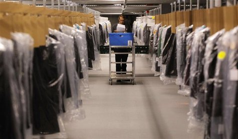 Associate Joseph Rodeheaver fills clothing orders at the Macy's-Bloomingdale's fulfillment center in Martinsburg, West Virginia in this Dece Associate Joseph Rodeheaver fills clothing orders at the Macy's-Bloomingdale's fulfillment center in Martinsburg, West Virginia in this Dece