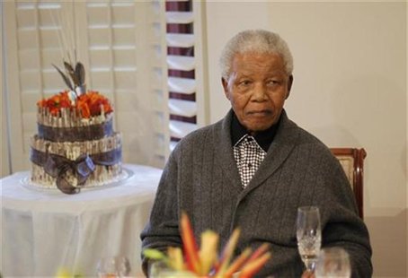 Former South African president Nelson Mandela looks on as he celebrates his birthday at his house in Qunu, Eastern Cape July 18, 2012. REUTE Former South African president Nelson Mandela looks on as he celebrates his birthday at his house in Qunu, Eastern Cape July 18, 2012. REUTE
