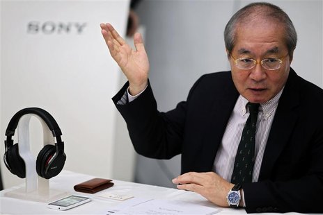 Sony China President Nobuki Kurita gestures as he gives a speech next to a Sony MDR-1R headset and a Sony mobile phone during a news confere Sony China President Nobuki Kurita gestures as he gives a speech next to a Sony MDR-1R headset and a Sony mobile phone during a news confere