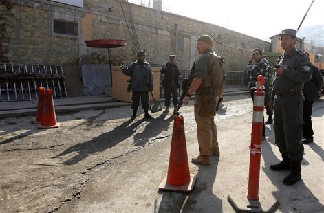 U.S. security personnel escorts a U.S. convoy to Kabul police headquarters in Kabul December 24, 2012. REUTERS/Mohammad Ismail U.S. security personnel escorts a U.S. convoy to Kabul police headquarters in Kabul December 24, 2012. REUTERS/Mohammad Ismail