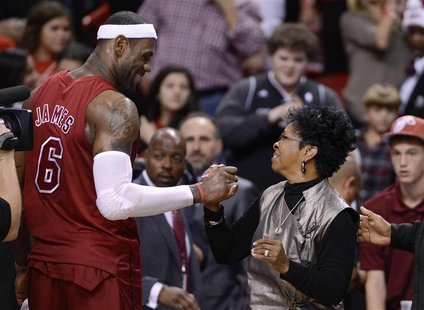 Miami Heat's LeBron James (L) is congratulated by recording artist Gladys Knight (R) following their NBA basketball game against the Oklahom Miami Heat's LeBron James (L) is congratulated by recording artist Gladys Knight (R) following their NBA basketball game against the Oklahom