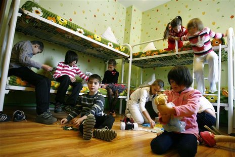 Orphan children play in their bedroom at an orphanage in the southern Russian city of Rostov-on-Don, December 19, 2012. REUTERS/Vladimir Kon Orphan children play in their bedroom at an orphanage in the southern Russian city of Rostov-on-Don, December 19, 2012. REUTERS/Vladimir Kon