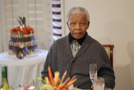 Former South African president Nelson Mandela looks on as he celebrates his birthday at his house in Qunu, Eastern Cape July 18, 2012. REUTE Former South African president Nelson Mandela looks on as he celebrates his birthday at his house in Qunu, Eastern Cape July 18, 2012. REUTE