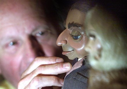 Gerry Anderson, the creator of the cult 1960's television series Thunderbirds, poses with the original Parker and Lady Penelope puppets at t Gerry Anderson, the creator of the cult 1960's television series Thunderbirds, poses with the original Parker and Lady Penelope puppets at t