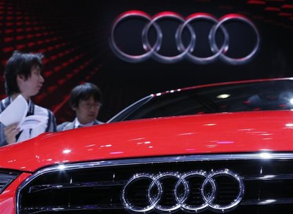 Visitors look at an Audi A3 on media day at the Paris Mondial de l'Automobile September 27, 2012. REUTERS/Christian Hartmann Visitors look at an Audi A3 on media day at the Paris Mondial de l'Automobile September 27, 2012. REUTERS/Christian Hartmann