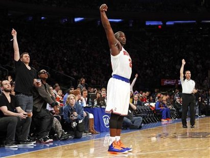 New York Knicks point guard Raymond Felton watches a three-point shot against the Cleveland Cavaliers in the third quarter of their NBA bask New York Knicks point guard Raymond Felton watches a three-point shot against the Cleveland Cavaliers in the third quarter of their NBA bask