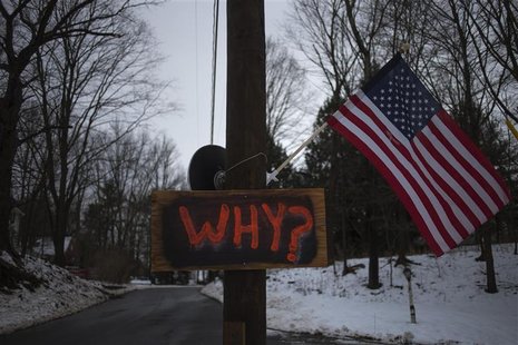 A sign is posted on an electricity pole outside a house near Sandy Hook Elementary School, nearly two weeks after a gunman shot dead 20 stud A sign is posted on an electricity pole outside a house near Sandy Hook Elementary School, nearly two weeks after a gunman shot dead 20 stud