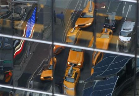 Taxis are reflected in a window in Times Square in New York December 17, 2012 REUTERS/Carlo Allegri Taxis are reflected in a window in Times Square in New York December 17, 2012 REUTERS/Carlo Allegri