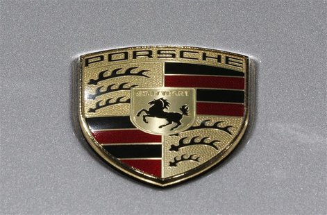 A Porsche logo is seen on a displayed car on media day at the Paris Mondial de l'Automobile September 27, 2012. REUTERS/Christian Hartmann A Porsche logo is seen on a displayed car on media day at the Paris Mondial de l'Automobile September 27, 2012. REUTERS/Christian Hartmann