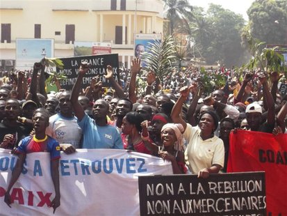 Supporters of Central African Republic President Francois Bozize and anti-rebel protesters chant slogans as they gather for an appeal for he Supporters of Central African Republic President Francois Bozize and anti-rebel protesters chant slogans as they gather for an appeal for he