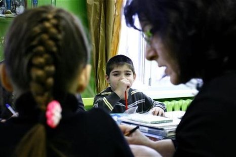 Orphan children attend a class at an orphanage in the southern Russian city of Rostov-on-Don, December 19, 2012. REUTERS/Vladimir Konstantin Orphan children attend a class at an orphanage in the southern Russian city of Rostov-on-Don, December 19, 2012. REUTERS/Vladimir Konstantin