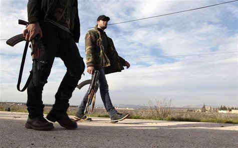 Free Syrian Army fighters walk as they seize Menagh military airport in north Aleppo December 28, 2012. REUTERS/Ahmed Jadallah Free Syrian Army fighters walk as they seize Menagh military airport in north Aleppo December 28, 2012. REUTERS/Ahmed Jadallah