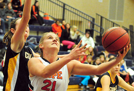 Hope forward Courtney Kust (21) goes up for a shot. Hope forward Courtney Kust (21) goes up for a shot.