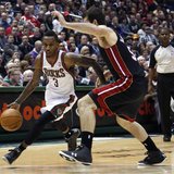Milwaukee Bucks guard Brandon Jennings (L) drives to the basket against Miami Heat center Josh Harrellson in the second half of their NBA ba Milwaukee Bucks guard Brandon Jennings (L) drives to the basket against Miami Heat center Josh Harrellson in the second half of their NBA ba