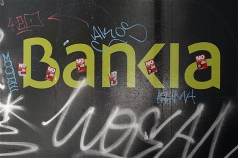 The logo of the Bankia bank is seen on a wall in Madrid May 25, 2012. REUTERS/Andrea Comas The logo of the Bankia bank is seen on a wall in Madrid May 25, 2012. REUTERS/Andrea Comas