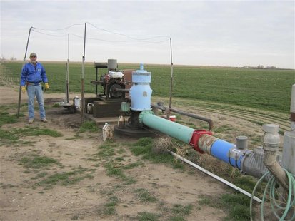 Farmer Gail Wright is pictured next to a water pump which he says he is likely to shut down because the Ogallala Aquifer no longer provides Farmer Gail Wright is pictured next to a water pump which he says he is likely to shut down because the Ogallala Aquifer no longer provides