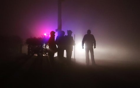 Policemen stand guard outside the cremation ground during the funeral of a rape victim after her body arrived from Singapore, in New Delhi D Policemen stand guard outside the cremation ground during the funeral of a rape victim after her body arrived from Singapore, in New Delhi D