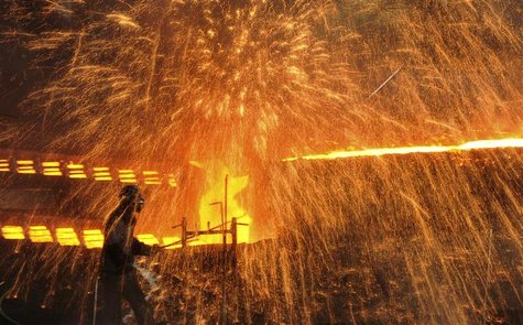 A labourer works at a steel factory in Dalian, Liaoning province December 4, 2012. REUTERS/China Daily A labourer works at a steel factory in Dalian, Liaoning province December 4, 2012. REUTERS/China Daily