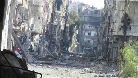 A view of buildings damaged by what activists said were missiles fired by a Syrian Air Force fighter jet loyal to President Bashar al-Assad A view of buildings damaged by what activists said were missiles fired by a Syrian Air Force fighter jet loyal to President Bashar al-Assad