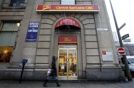 A pedestrian walks past a CIBC branch in Montreal, February 25, 2010. REUTERS/Christinne Muschi A pedestrian walks past a CIBC branch in Montreal, February 25, 2010. REUTERS/Christinne Muschi