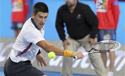 Novak Djokovic of Serbia hits a return to Andreas Seppi of Italy during their men's singles match at the Hopman Cup tennis tournament in Per Novak Djokovic of Serbia hits a return to Andreas Seppi of Italy during their men's singles match at the Hopman Cup tennis tournament in Per