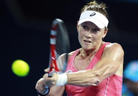 Samantha Stosur of Australia hits a return against Sofia Arvidsson of Sweden during their women's singles match at the Brisbane Internationa Samantha Stosur of Australia hits a return against Sofia Arvidsson of Sweden during their women's singles match at the Brisbane Internationa