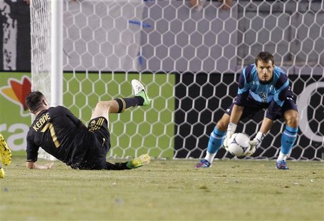 Tottenham Hotspur's goalkeeper Carlo Cudicini (R) makes a save on Los Angeles Galaxy's Robbie Keane (L) during the first half of an internat Tottenham Hotspur's goalkeeper Carlo Cudicini (R) makes a save on Los Angeles Galaxy's Robbie Keane (L) during the first half of an internat