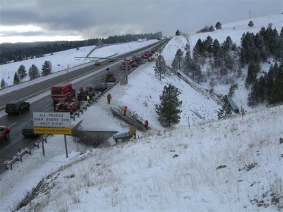 Rescue personnel respond to the scene of a charter bus crash on I-84, east of Pendleton, Oregon in this December 30, 2012 handout photo. REU Rescue personnel respond to the scene of a charter bus crash on I-84, east of Pendleton, Oregon in this December 30, 2012 handout photo. REU