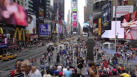 Tourists gather in Times Square in New York August 6, 2012. REUTERS/Charles Platiau Tourists gather in Times Square in New York August 6, 2012. REUTERS/Charles Platiau