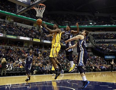 Indiana Pacers center Roy Hibbert puts up a shot defended by Memphis Grizzlies guard Mike Conley (L), Grizzlies forward Rudy Gay (2nd R) and Indiana Pacers center Roy Hibbert puts up a shot defended by Memphis Grizzlies guard Mike Conley (L), Grizzlies forward Rudy Gay (2nd R) and