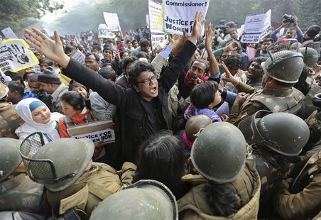 Demonstrators shout slogans as they are surrounded by the police during a protest rally in New Delhi in this December 27, 2012 file photo. B Demonstrators shout slogans as they are surrounded by the police during a protest rally in New Delhi in this December 27, 2012 file photo. B