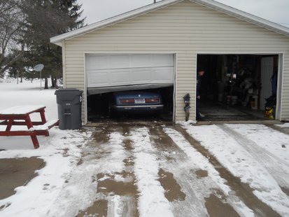 The Blue Riviera can be seen inside the garage where it ended up after crashing through the closed door. The Blue Riviera can be seen inside the garage where it ended up after crashing through the closed door.