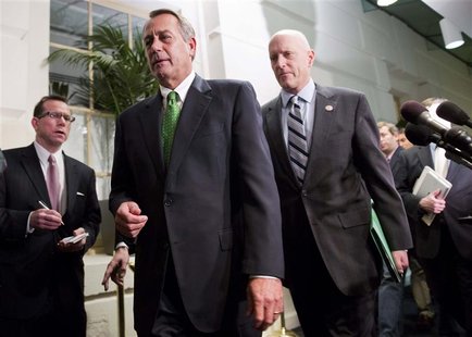 Speaker of the House John Boehner (R-OH) (front, in green tie) walks with Congressman Dave Camp (R-MI) (R) after a meeting with House Republ Speaker of the House John Boehner (R-OH) (front, in green tie) walks with Congressman Dave Camp (R-MI) (R) after a meeting with House Republ