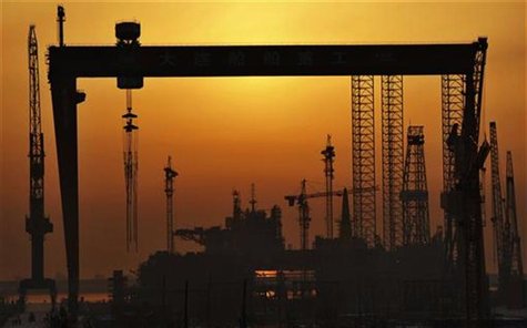 The Dalian Shipbuilding Industry Co.,Ltd working area is seen at sunrise in Dalian, Liaoning province, January 1, 2013. REUTERS/China Daily The Dalian Shipbuilding Industry Co.,Ltd working area is seen at sunrise in Dalian, Liaoning province, January 1, 2013. REUTERS/China Daily