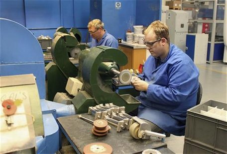Employees of JJ Churchill precision engineering polish turbine blades in the company's factory in Market Bosworth, central England, October Employees of JJ Churchill precision engineering polish turbine blades in the company's factory in Market Bosworth, central England, October