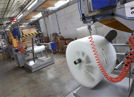 A machine that makes bubble wrap padded envelopes is pictured at the Wrap-Tite manufacturing facility in Solon, Ohio July 13, 2012. REUTERS/ A machine that makes bubble wrap padded envelopes is pictured at the Wrap-Tite manufacturing facility in Solon, Ohio July 13, 2012. REUTERS/