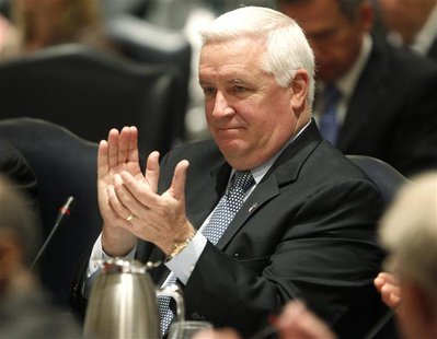 Pennsylvania Governor Tom Corbett applauds the introduction of Penn State University's interim president Rodney Erickson during the trustees Pennsylvania Governor Tom Corbett applauds the introduction of Penn State University's interim president Rodney Erickson during the trustees