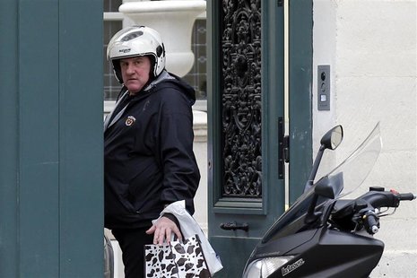 French actor Gerard Depardieu enters his home in Paris December 19, 2012. REUTERS/Benoit Tessier French actor Gerard Depardieu enters his home in Paris December 19, 2012. REUTERS/Benoit Tessier