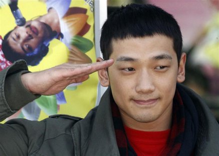 South Korean pop singer Rain salutes his fans before he joins the army in front of an army recruit training centre in Uijeongbu, north of Se South Korean pop singer Rain salutes his fans before he joins the army in front of an army recruit training centre in Uijeongbu, north of Se