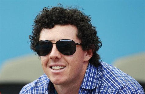 Golfer Rory McIlroy of Northern Ireland watches as his girlfriend Caroline Wozniacki of Denmark plays Ksenia Pervak of Kazakhstan during the Golfer Rory McIlroy of Northern Ireland watches as his girlfriend Caroline Wozniacki of Denmark plays Ksenia Pervak of Kazakhstan during the