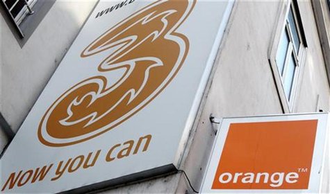 The logos of "Orange" and "3" are pictured outside a telecommunications store in Vienna February 3, 2012. REUTERS/Heinz-Peter Bader The logos of "Orange" and "3" are pictured outside a telecommunications store in Vienna February 3, 2012. REUTERS/Heinz-Peter Bader