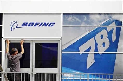 A worker prepares the Boeing chalet ahead of the Farnborough Airshow 2012 in southern England July 8, 2012. REUTERS/Luke MacGregor A worker prepares the Boeing chalet ahead of the Farnborough Airshow 2012 in southern England July 8, 2012. REUTERS/Luke MacGregor