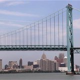 The Detroit city skyline is seen behind the Ambassador Bridge, an international border-crossing linking Windsor, Ontario with Detroit, along The Detroit city skyline is seen behind the Ambassador Bridge, an international border-crossing linking Windsor, Ontario with Detroit, along