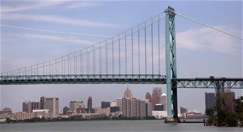 The Detroit city skyline is seen behind the Ambassador Bridge, an international border-crossing linking Windsor, Ontario with Detroit, along The Detroit city skyline is seen behind the Ambassador Bridge, an international border-crossing linking Windsor, Ontario with Detroit, along