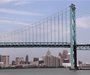 The Detroit city skyline is seen behind the Ambassador Bridge, an international border-crossing linking Windsor, Ontario with Detroit, along