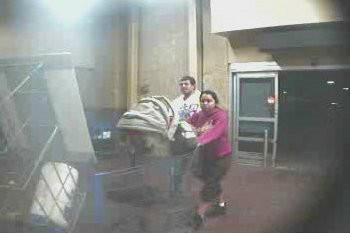 The suspect is seen with a young girl and an infant outside the Walmart store. The suspect is seen with a young girl and an infant outside the Walmart store.