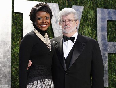 Director George Lucas and his partner Mellody Hobson arrive at the 2012 Vanity Fair Oscar party in West Hollywood, California in this Februa Director George Lucas and his partner Mellody Hobson arrive at the 2012 Vanity Fair Oscar party in West Hollywood, California in this Februa